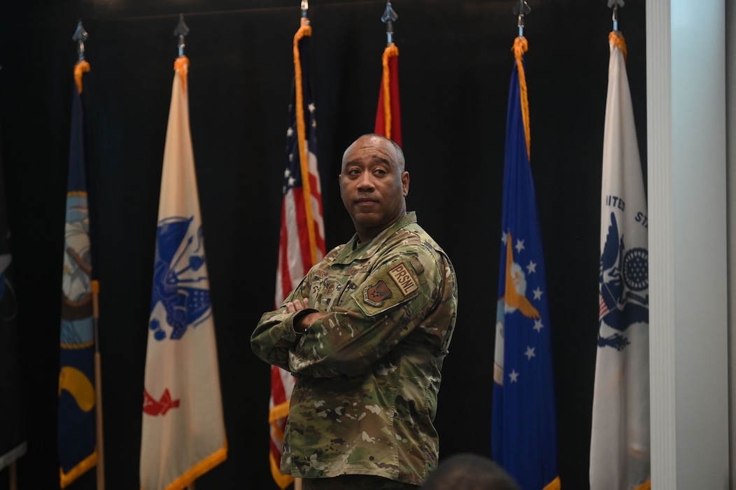 U.S. Air Force Chief Master Sgt. Randolph Livingston III,  HQ AFPC FAM Assignments superintendent, participates in a briefing at the Powell Event Center, Goodfellow Air Force Base, Texas, June 5, 2024. The HQ AFPC FAM team strengthened the partnership between Goodfellow and the AFPC by reinforcing their shared commitment to providing airmen with the resources they need to succeed in their military careers.  (U.S. Air Force photo by Airman 1st Class James Salellas)