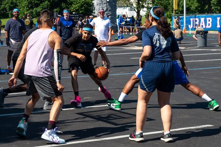 military personnel playing a game of basketball