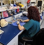 A student works in the maxillofacial laboratory. The Maxillofacial Dental Laboratory Technician course recently transitioned from the Navy Bureau of Medicine and Surgery to the Medical Education and Training Campus.