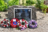 The memorial dedicated to the 437th Troop Carrier Group at RAF Ramsbury, adorned with wreaths laid during the RAF Ramsbury Community Fair, June 8, 2024, in Ramsbury, U.K. The memorial honors the units based at RAF Ramsbury from 1942 to 1946 and their significant contributions during D-Day and throughout World War II. (U.S. Air Force photo by 1st Lt. Taylor Ferry)