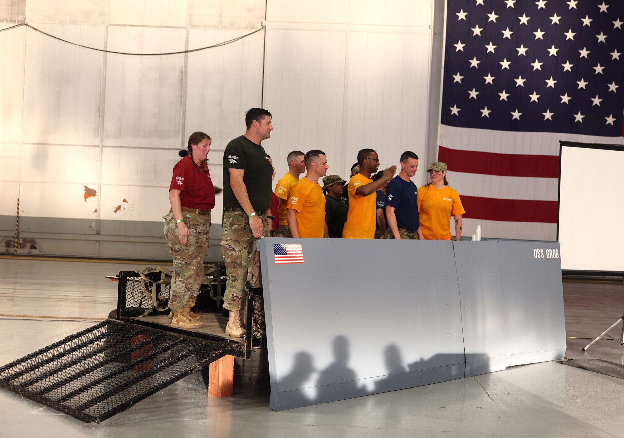 men and women standing on platform