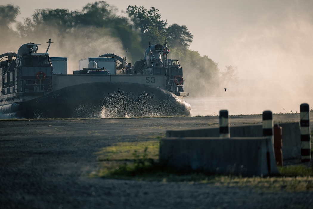 A U.S. Navy Landing Craft Air Cushion approaches a beach during the Annual Amphibious Mobility Exercise at Marine Corps Air Facility on Marine Corps Base Quantico, Virginia, May, 3, 2024. The LCAC is a class of air-cushioned landing craft used by the Navy to transport weapons systems, equipment, cargo and personnel from ship to shore and across the beach. (U.S. Marine Corps photo by Lance Cpl. Ethan Miller)