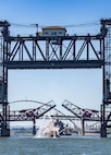 Independence-variant littoral combat ship USS Montgomery (LCS 8), transits under Portland's Broadway Bridge for the annual Rose Festival during Portland Fleet Week in Portland, Oregon, June 5, 2024. Portland Fleet Week is a time-honored celebration of the sea services and provides an opportunity for the citizens of Oregon to meet Sailors, Marines and Coast Guardsmen, as well as witness firsthand the latest capabilities of today’s maritime services. (U.S. Navy photo by Mass Communication Specialist 2nd Class Gwendelyn L. Ohrazda)