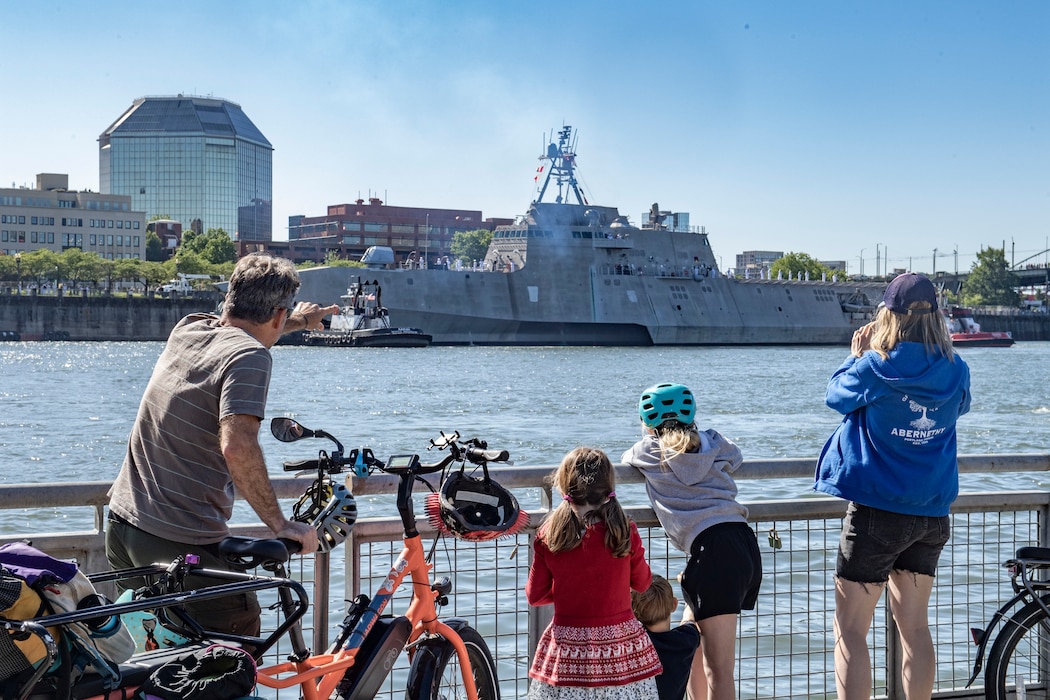 The Stoerts-Barrett family waves as the Independence-variant littoral combat ship USS Montgomery (LCS 8) arrives for the annual Rose Festival during Portland Fleet Week in Portland, Oregon, June 5, 2024. Portland Fleet Week is a time-honored celebration of the sea services and provides an opportunity for the citizens of Oregon to meet Sailors, Marines and Coast Guardsmen, as well as witness firsthand the latest capabilities of today’s maritime services. (U.S. Navy photo by Mass Communication Specialist 2nd Class Gwendelyn L. Ohrazda)