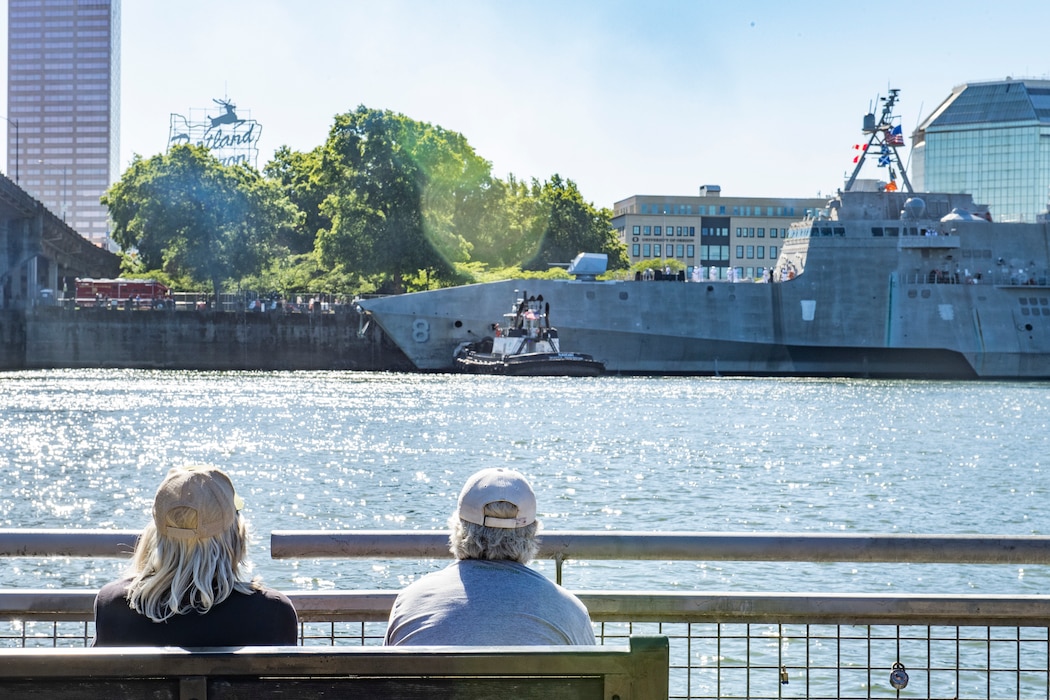 Kris McElwee and Doug Pyle watch the Independence-variant littoral combat ship USS Montgomery (LCS 8) arrive for the annual Rose Festival during Portland Fleet Week in Portland, Oregon, June 5, 2024. Portland Fleet Week is a time-honored celebration of the sea services and provides an opportunity for the citizens of Oregon to meet Sailors, Marines and Coast Guardsmen, as well as witness firsthand the latest capabilities of today’s maritime services. (U.S. Navy photo by Mass Communication Specialist 2nd Class Gwendelyn L. Ohrazda)