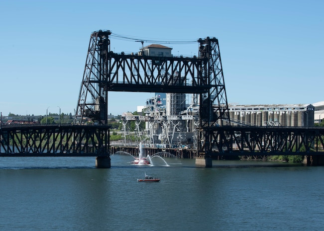 A Portland Fire and Rescue Fireboat sprays water as the Independence-variant littoral combat ship USS Montgomery (LCS 8) arrives for the annual Rose Festival during Portland Fleet Week in Portland, Oregon June 5, 2024. Portland Fleet Week is a time-honored celebration of the sea services and provides an opportunity for the citizens of Oregon to meet Sailors, Marines and Coast Guardsmen, as well as witness firsthand the latest capabilities of today’s maritime services. (U.S. Navy photo by Mass Communication Specialist 1st Class Heather C. Wamsley)