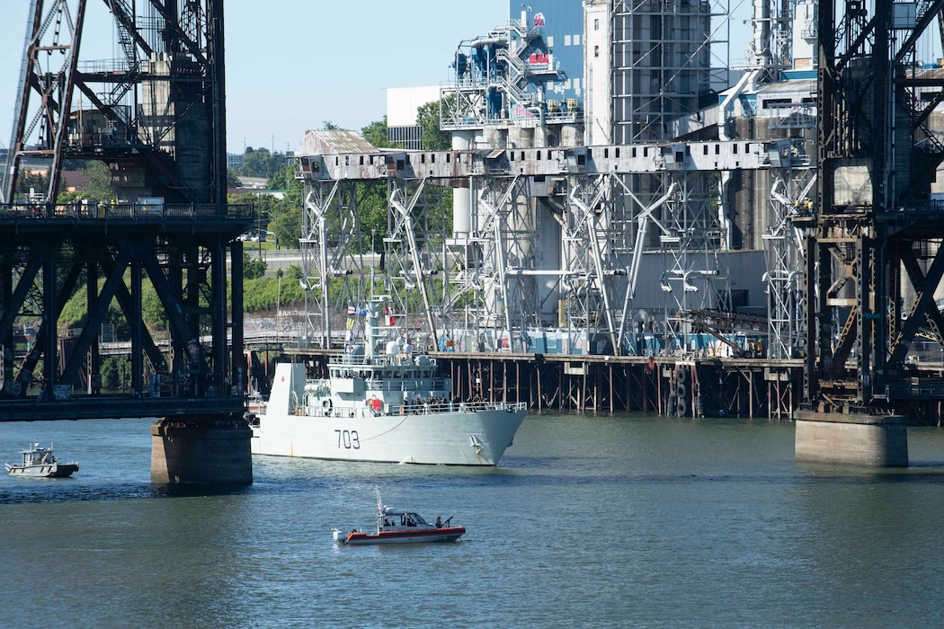 The Kingston-class coastal defense vessel HMCS Edmonton (MM 703) transits under Steel Bridge for the annual Rose Festival during Portland Fleet Week in Portland, Oregon June 5, 2024. Portland Fleet Week is a time-honored celebration of the sea services and provides an opportunity for the citizens of Oregon to meet Sailors, Marines and Coast Guardsmen, as well as witness firsthand the latest capabilities of today’s maritime services. (U.S. Navy photo by Mass Communication Specialist 1st Class Heather C. Wamsley)