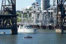 The Kingston-class coastal defense vessel HMCS Edmonton (MM 703) transits under Steel Bridge for the annual Rose Festival during Portland Fleet Week in Portland, Oregon June 5, 2024. Portland Fleet Week is a time-honored celebration of the sea services and provides an opportunity for the citizens of Oregon to meet Sailors, Marines and Coast Guardsmen, as well as witness firsthand the latest capabilities of today’s maritime services. (U.S. Navy photo by Mass Communication Specialist 1st Class Heather C. Wamsley)