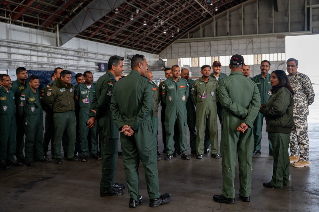 A group of members from the Indian Air Force stand in a circle.