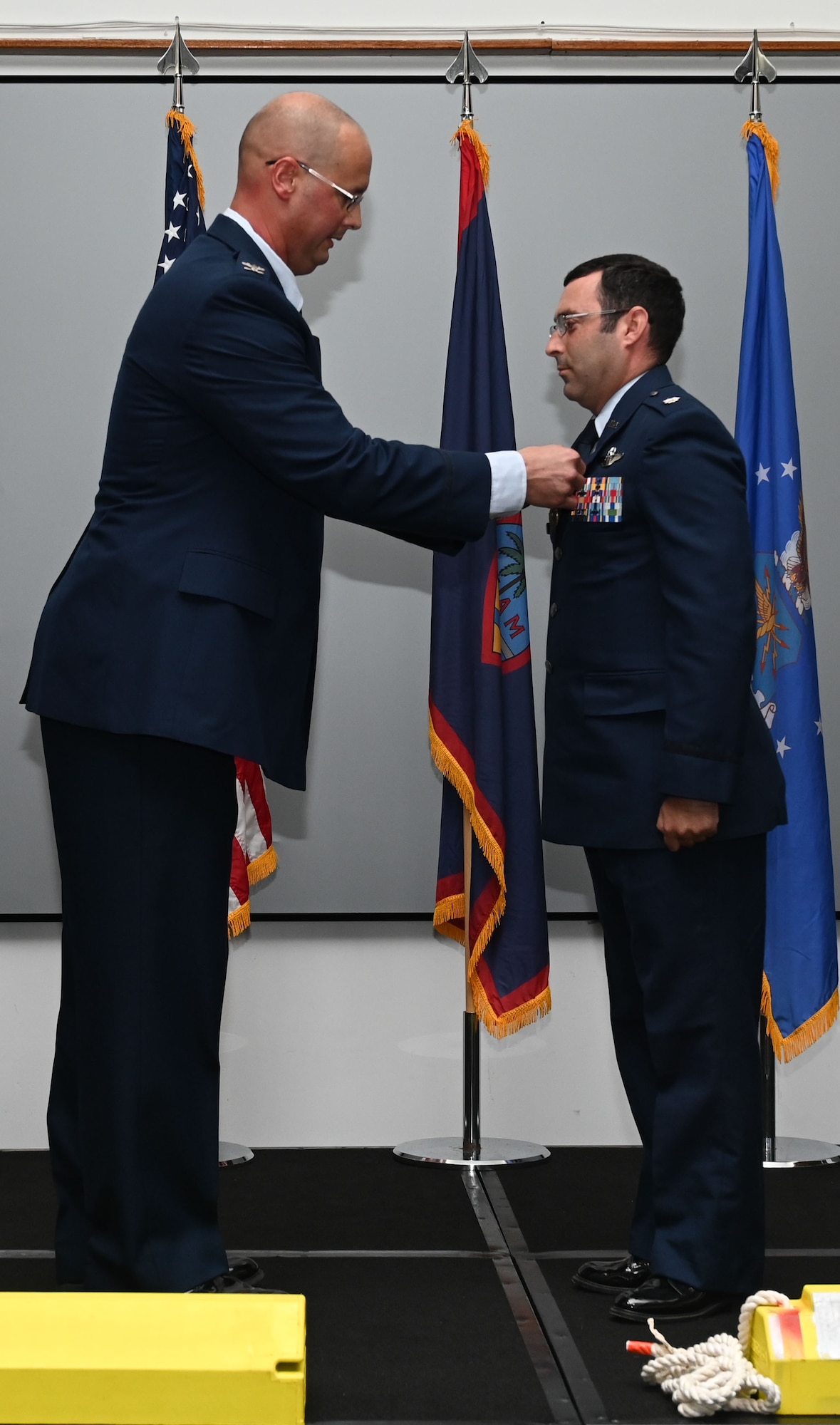 U.S. Air Force Col. Richard McElhaney, commander of the 36th Contingency Response Group, pins a medal on Lt. Col. Stephen Smith, 36th Contingency Response Squadron commander, at Andersen Air Force Base, Guam, June 10, 2024. Smith was recognized for his accomplishments as commander of the 36th CRS. (U.S. Air Force photo by Airman 1st Class Natasha Ninete).