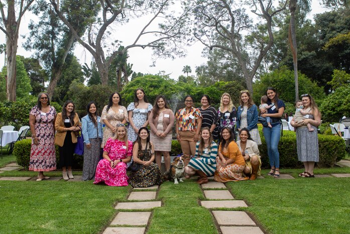 U.S. Marine Corps Pfc. Bruno, the mascot of Marine Corps Recruit Depot San Diego and the Western Recruiting Region, and spouses of Marines and Sailors with MCRD San Diego pose for a group photo during a spouse appreciation event at MCRD San Diego, California, May 29, 2024. The event was held to show appreciation for the spouses of Marines and Sailors stationed at the Depot. (U.S. Marine Corps photo by Lance Cpl. Janell B. Alvarez)