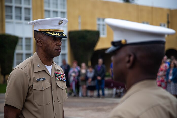 U.S. Marine Corps Col. Joseph W. Jones, left, the assistant chief of staff for the G-3 at Marine Corps Recruit Depot San Diego, stands at attention during an award ceremony at MCRD San Diego, California, June 7, 2024. Jones was awarded the Legion of Merit medal, a United States Armed Forces award given for exceptionally meritorious conduct in the performance of outstanding services and achievements. Jones will be retiring in August after 30 years of service in the Marine Corps.(U.S. Marine Corps photo by Cpl. Elliott A. Flood-Johnson)