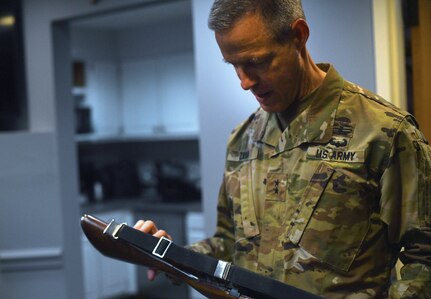 U.S. Army Maj. Gen. William Zana, director of international affairs with the National Guard Bureau, examines a ceremonial M14 rifle as he prepares to stand one final watch over the Tomb of the Unknown Soldier at Arlington National Cemetery May 31, 2024. Zana, who served as a Tomb guard early in his career, stood watch over the Tomb as his final act in uniform. Just after completing his watch, at midnight, June 1, Zana would officially be retired from the Army.