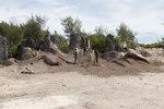U.S. Marine Corps, Australian Army, and Canadian Army service members overlook a detonation area of a demolition site during Operation Render Safe Nauru at Yaren, Nauru, May 30, 2024.