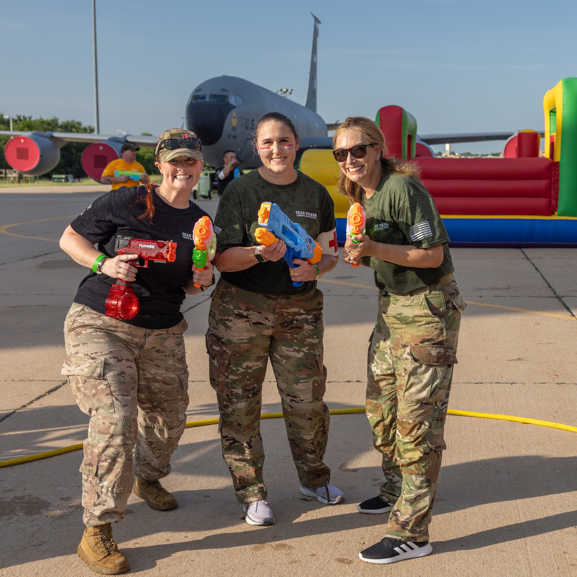 three women with water guns