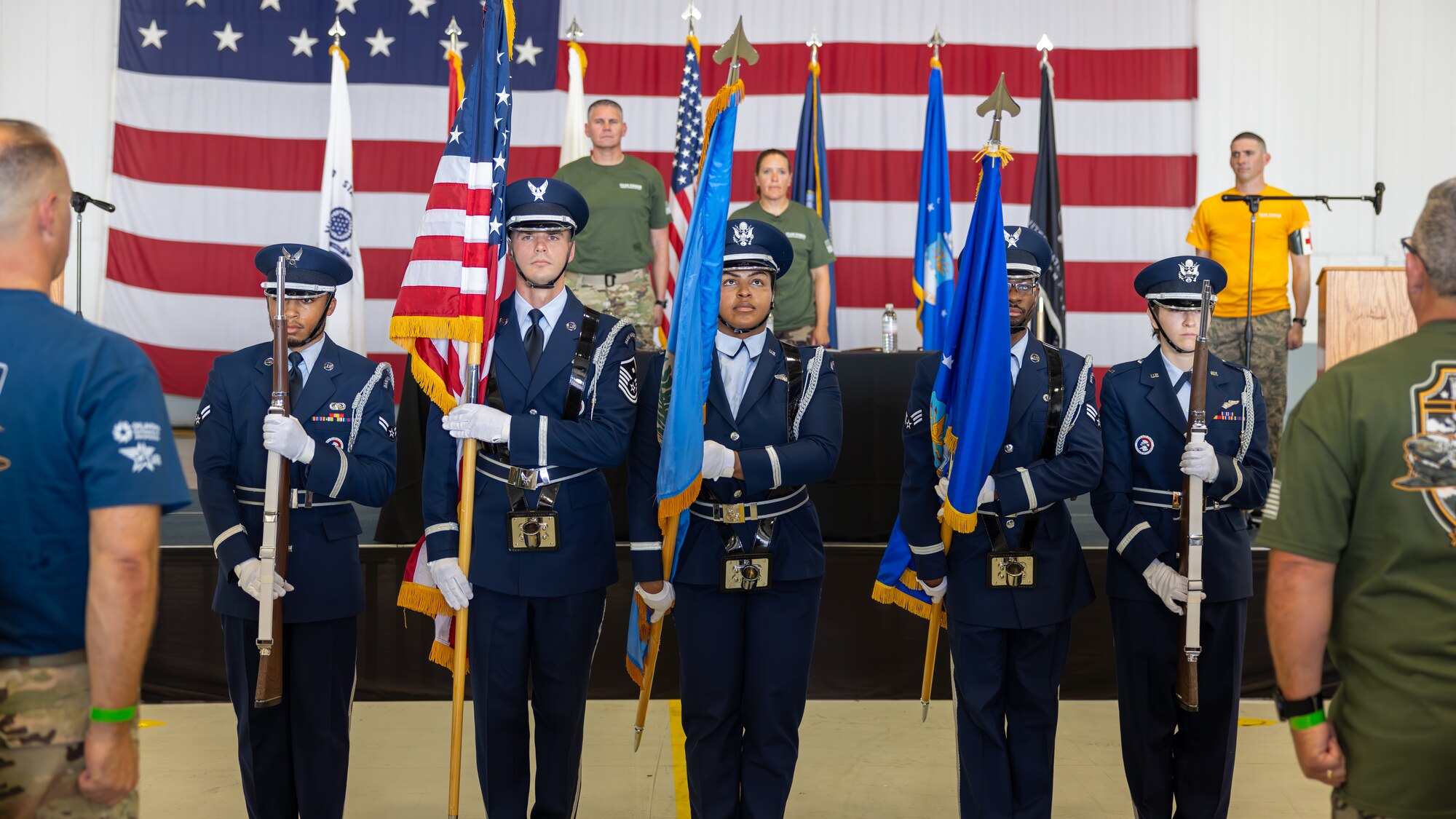 Men and women holding flags