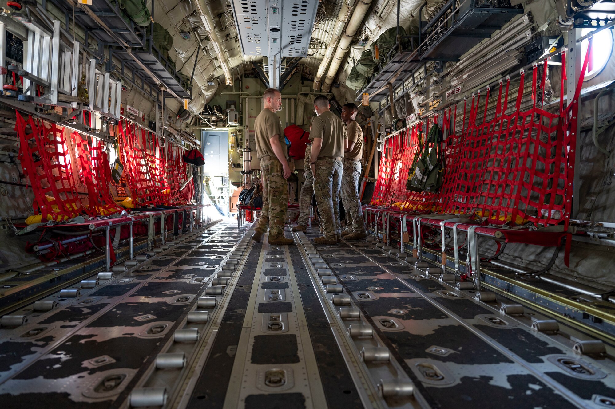 U.S. Air Force Airmen assigned to the 40th Airlift Squadron prepare to take off for a cargo transport mission to Andersen Air Force Base, Guam, and Tinian International Airport, Tinian Island, during exercise Valiant Shield 24 at Antonio B. Won Pat International Airport, Guam, June 7, 2024. Members of the 317th Airlift Wing transported 27 passengers and 50,000 pounds of cargo to ensure the Tinian International Airport stays in operationally ready status. (U.S. Air Force photo by Airman 1st Class Emma Anderson)