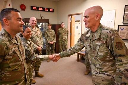 Col. William Gutermuth, 433rd Airlift Wing commander, shakes hands with leadership from the 26th and 74th Aerial Port Squadrons during a tour to varying 433rd AW units to say farewell on his final Unit Training Assembly drill weekend here at Joint Base San Antonio-Lackland, Texas, June 7, 2024.