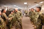 Col. William Gutermuth, 433rd Airlift Wing commander, shakes hands with members from the 26th and 74th Aerial Port Squadrons during a tour to varying 433rd AW units to say farewell on his final Unit Training Assembly drill weekend here at Joint Base San Antonio-Lackland, Texas, June 7, 2024.