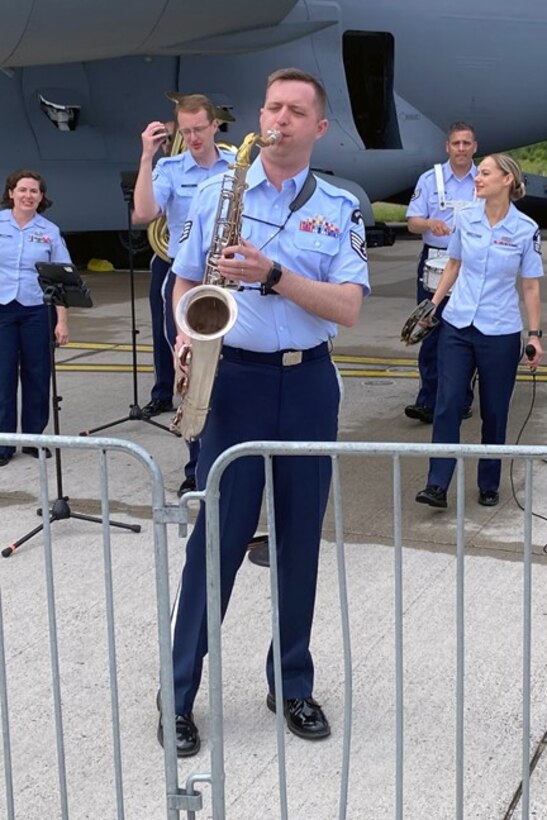 Staff Sgt. Joe Rulli performs with the Wings of Swing, part of the U.S. Air Forces in Europe-Air Force Africa band, performs during industry days at the Berlin Innovation & Leadership in Aerospace trade show and air show, June 5, 2024, in Berlin, Germany. The band’s mission is to be build international relationships through a shared love of music. The band played at the industry days, ceremonial events at government centers in Berlin and at the show’s public days. (U.S. Air Force photo by Senior Master Sgt. Dan Heaton)