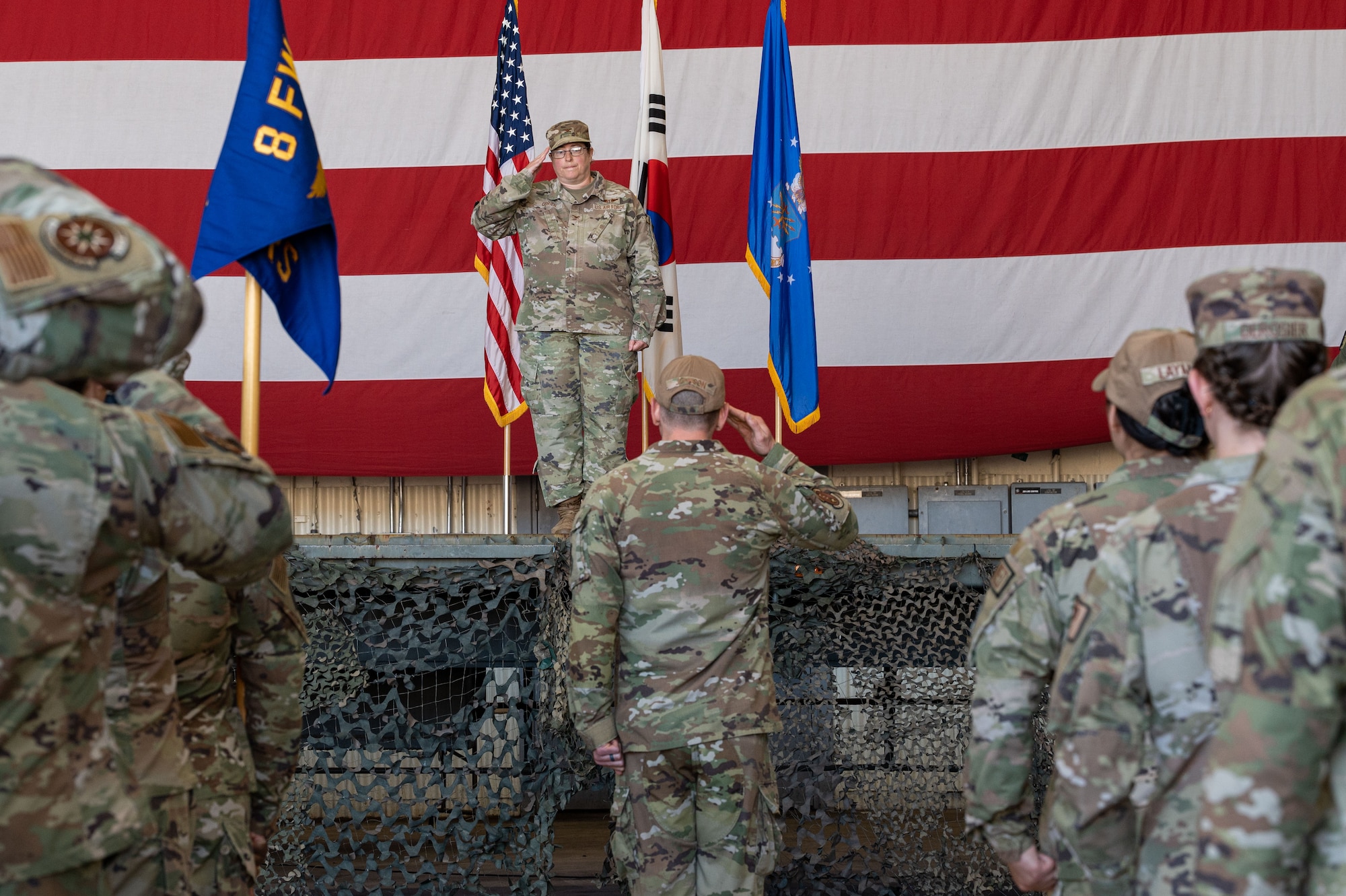 U.S. Air Force Col. Valerie OBrien, 8th Medical Group incoming commander, renders her first salute as commander during the 8th MDG change of command ceremony.