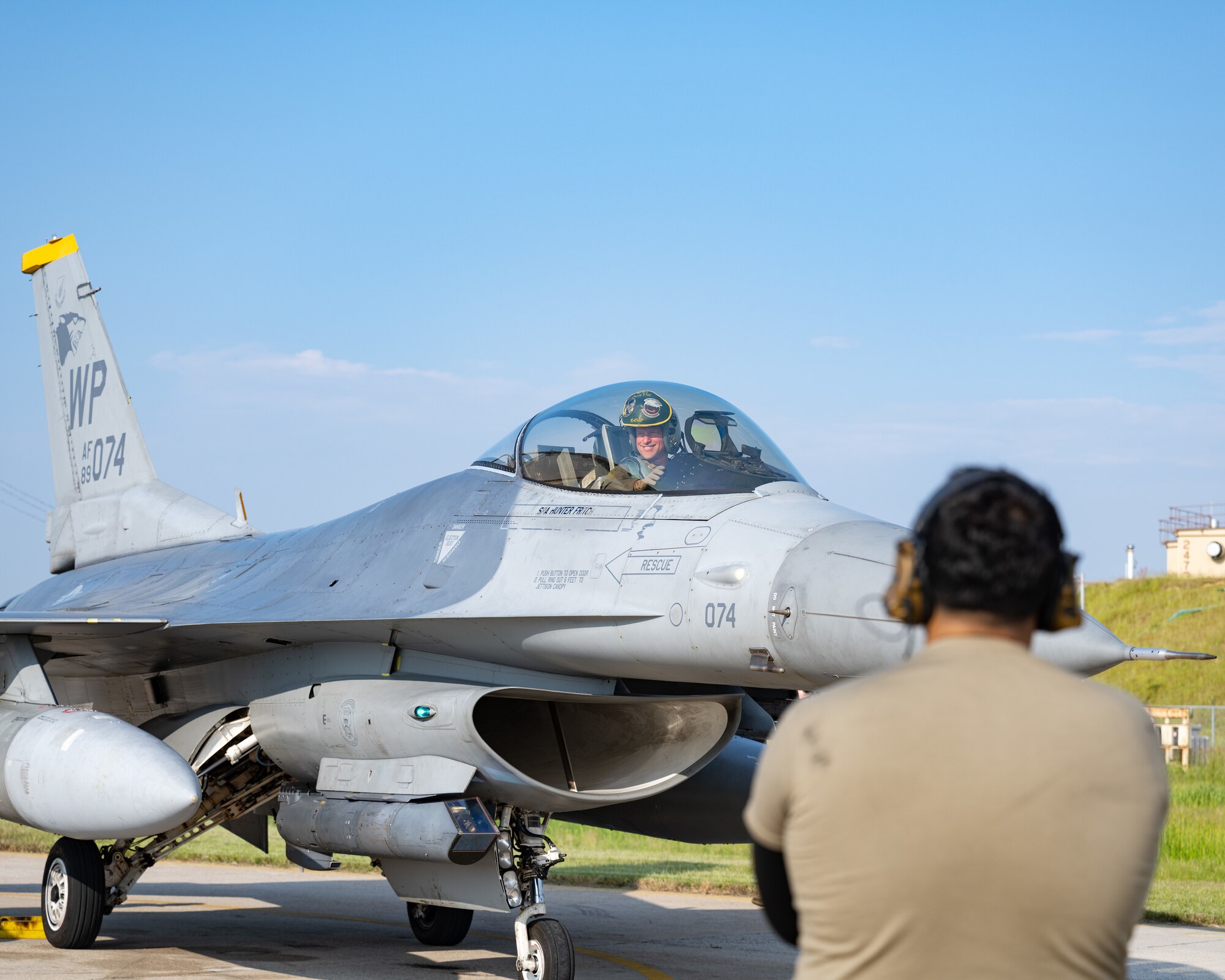 U.S. Air Force Col. Matthew Gaetke, 8th Fighter Wing commander, smiles at friends and family after completing his final flight as commander of the 8th FW at Kunsan Air Base, Republic of Korea.