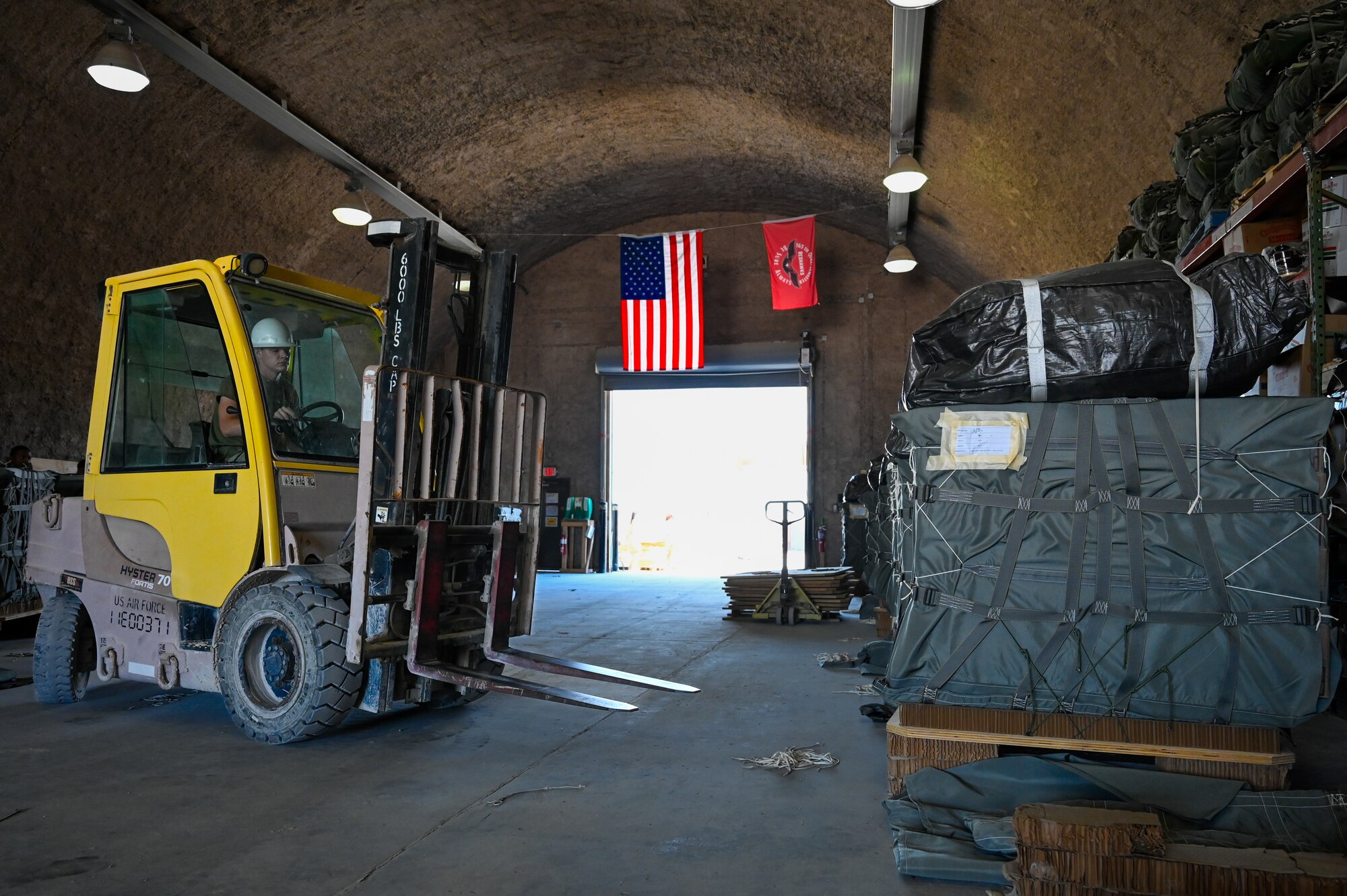 Airmen from the 379th Air Expeditionary Wing and joint and coalition partners volunteered to package air drops with the U.S. Army’s 165th Quartermaster Company. (U.S. Air Force photo)