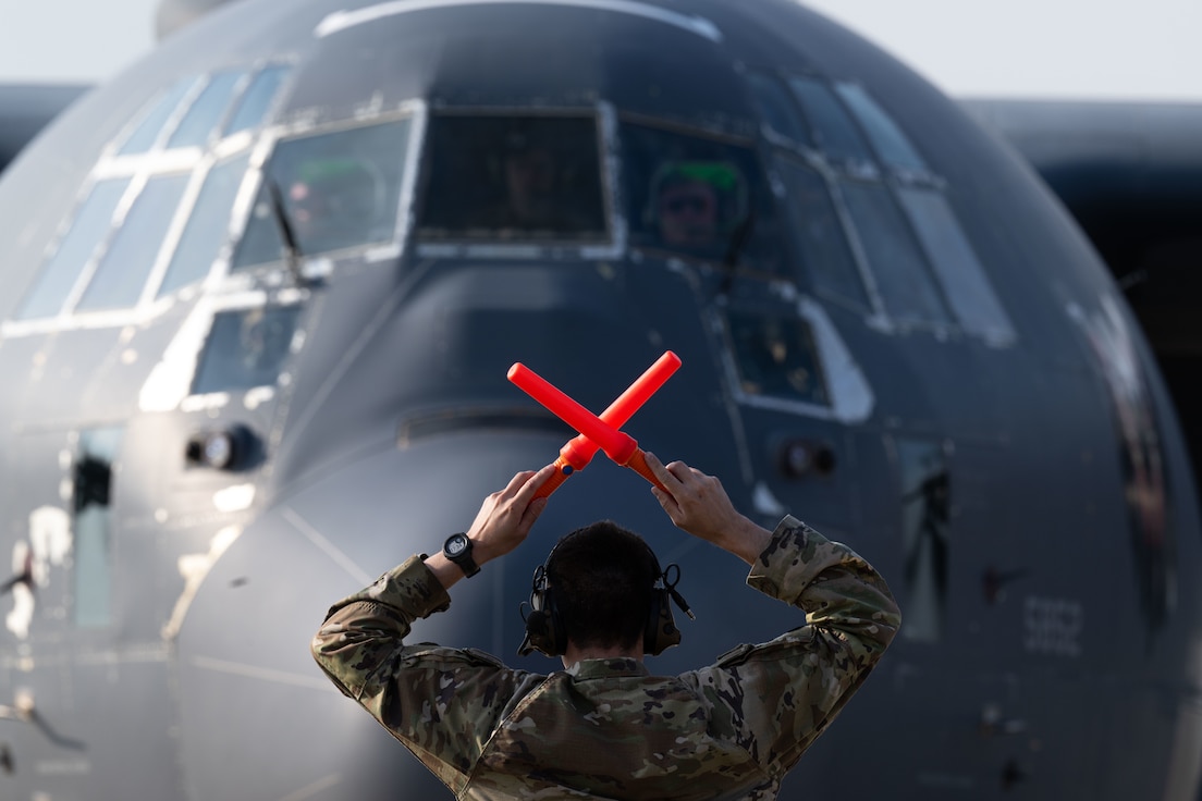 U.S. Air Force Staff Sgt. Shane Eiring, transient alert craftsman with the 51st Maintenance Squadron marshals an AC-130J Ghostrider gunship assigned to the 4th Special Operations Squadron from Hulburt Field, Fla. at Osan Air Base, Republic of Korea (ROK) June 11, 2024. The Ghostrider and its crews are participating in a regularly scheduled joint, combined exchange and training (JCET) event designed to positively affect the combat readiness of special operations forces (SOF) personnel in support of the mutual defense of the U.S. and ROK homelands. (U.S. Air Force photo by Senior Airman Jacob Cabanero)