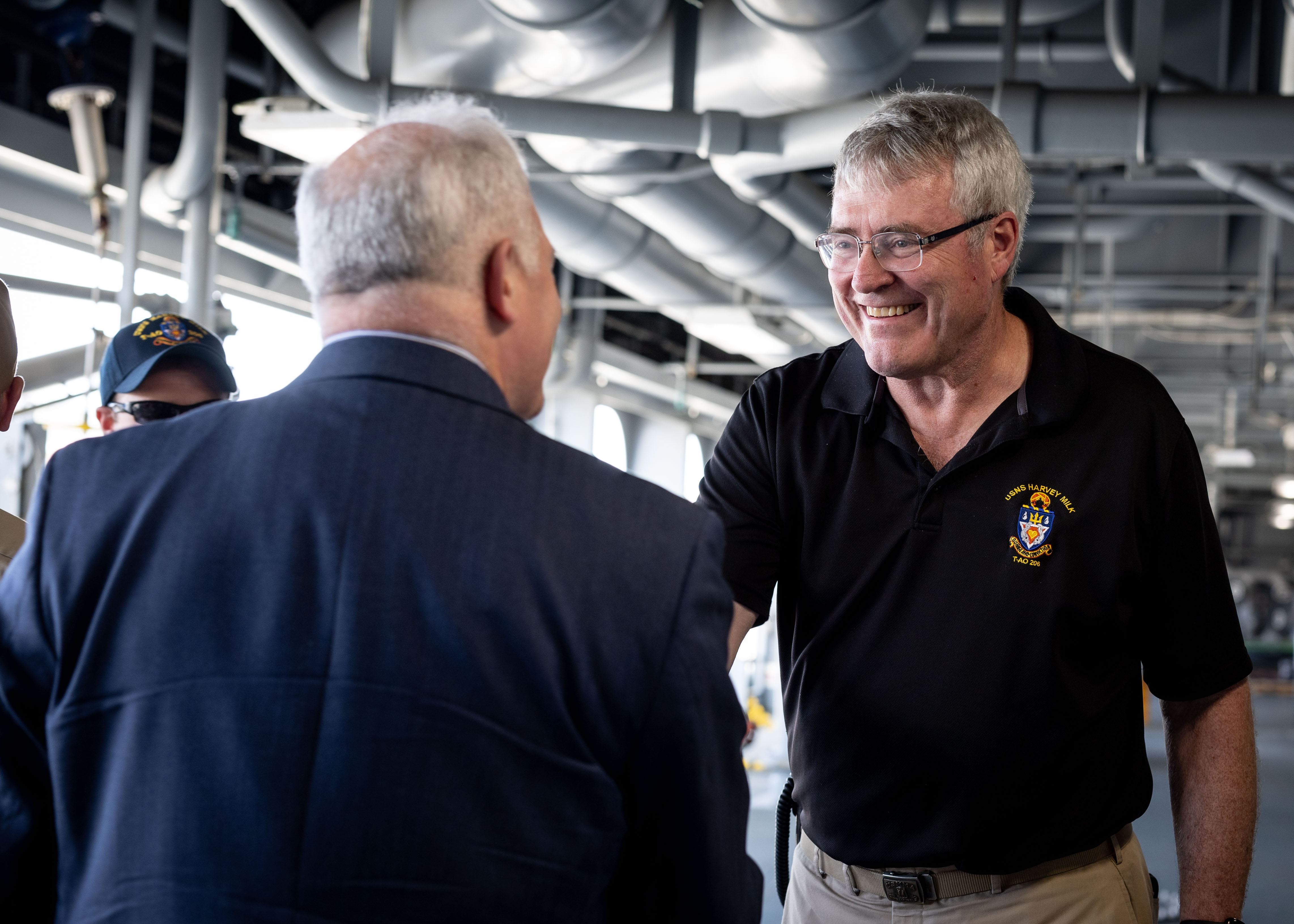 Captain James J. White, Ship Master, USNS Harvey Milk (T-AO 206), greets Military Sealift Command personnel, and Mr. Steven Brock, Senior Advisor, Secretary of the Navy, as they arrive aboard Milk June 3, 2024. in addition to the ship tour, Brock met with MSC leadership for an office call to discuss new construction, expansion initiatives, and force generation.