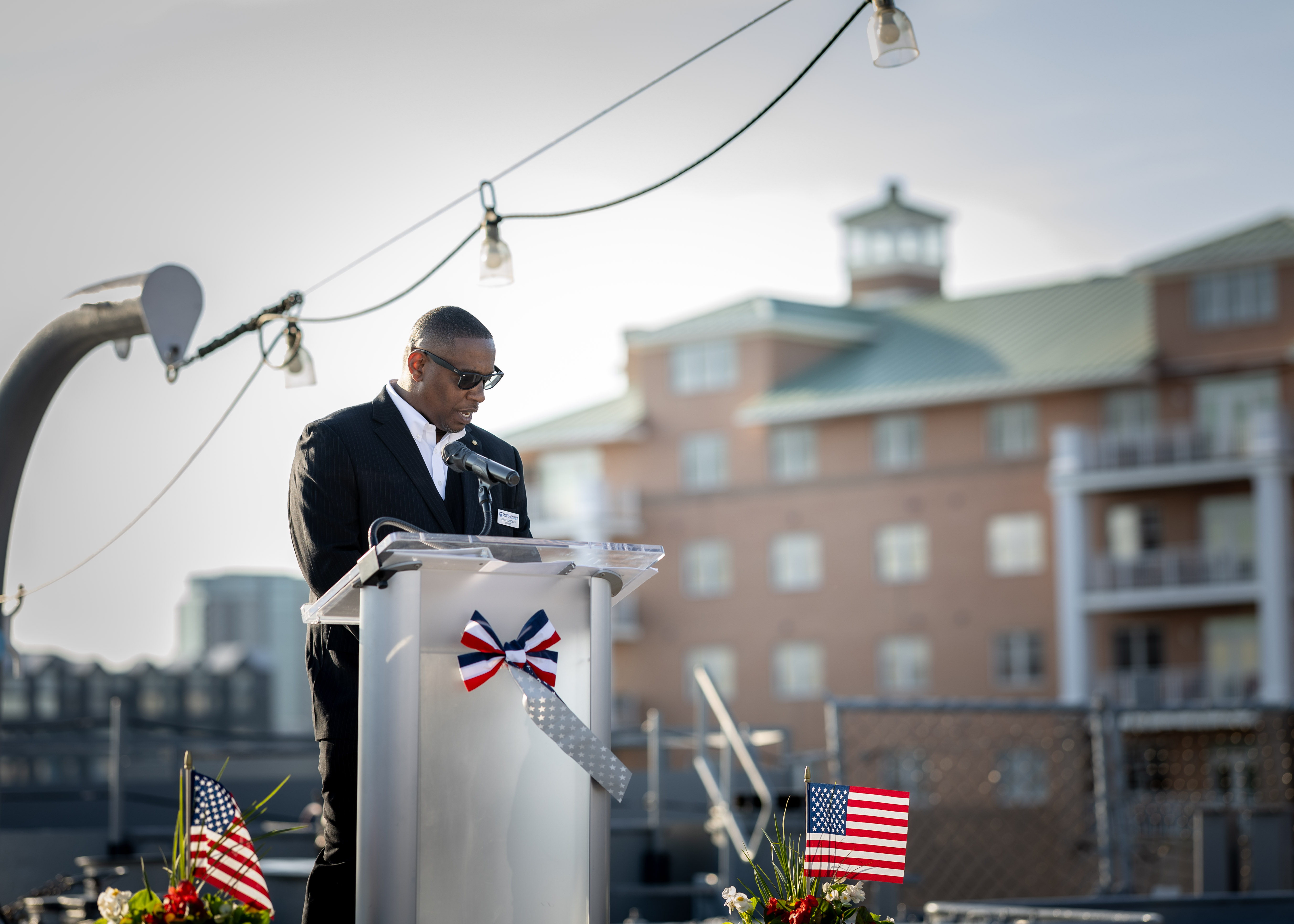 Terrell Moses, 1st Vice President, Propeller Club, Port of Norfolk, delivers remarks during the 2024 National Maritime Day ceremony hosted by the Propeller Club, Port of Norfolk, on board USS Wisconsin (BB-64) May 22, 2024. National Maritime Day honors the work and contributions of past merchant seaman who endured the perils of the sea during times of war and peace, and recognizes those who proudly carry on that tradition today.