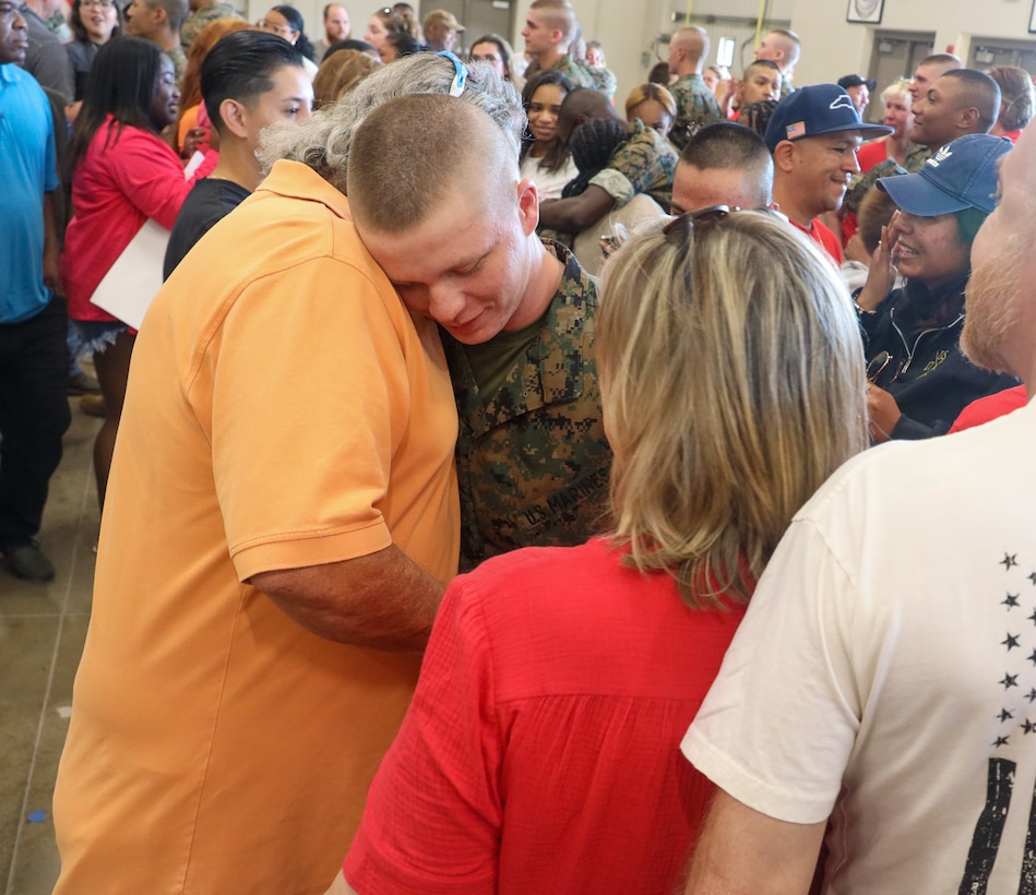 Pvt. William Smith, a recruit with Bravo Company, 1st Recruit Training Battalion, embraces his family on family day on Marine Corps Recruit Depot Parris Island, S.C., May 31, 2024. Following the liberty call and formal release from their Series Commanders, the new Marines embrace and share the time with their families for the first time after 13 weeks apart. (U.S. Marine Corps photo by Sgt. Juan Munguia)