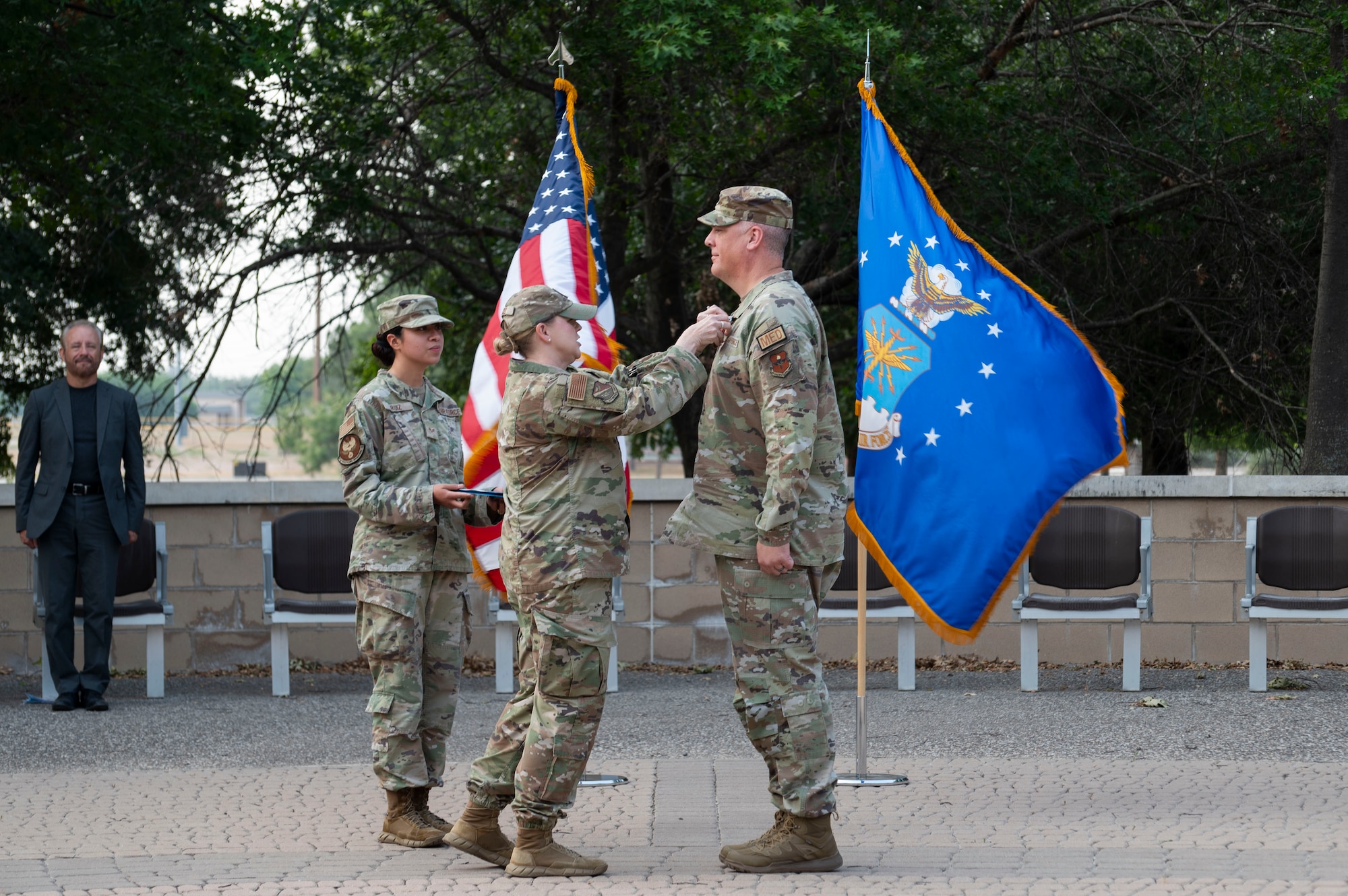 U.S. Air Force Col. Angela Lacek, 47th Medical Group commander, pins a Meritorious Service Medal onto Lt. Col. Neil Boots, former 47th Healthcare Operations Squadron (HCOS) commander, during the 47th HCOS change of command ceremony at Laughlin Air Force Base, Texas, June 7, 2024. The Meritorious Service Medal was established as the counterpart of the Bronze Star Medal for the recognition of meritorious noncombatant service. (U.S. Air Force photo by Senior Airman Kailee Reynolds)
