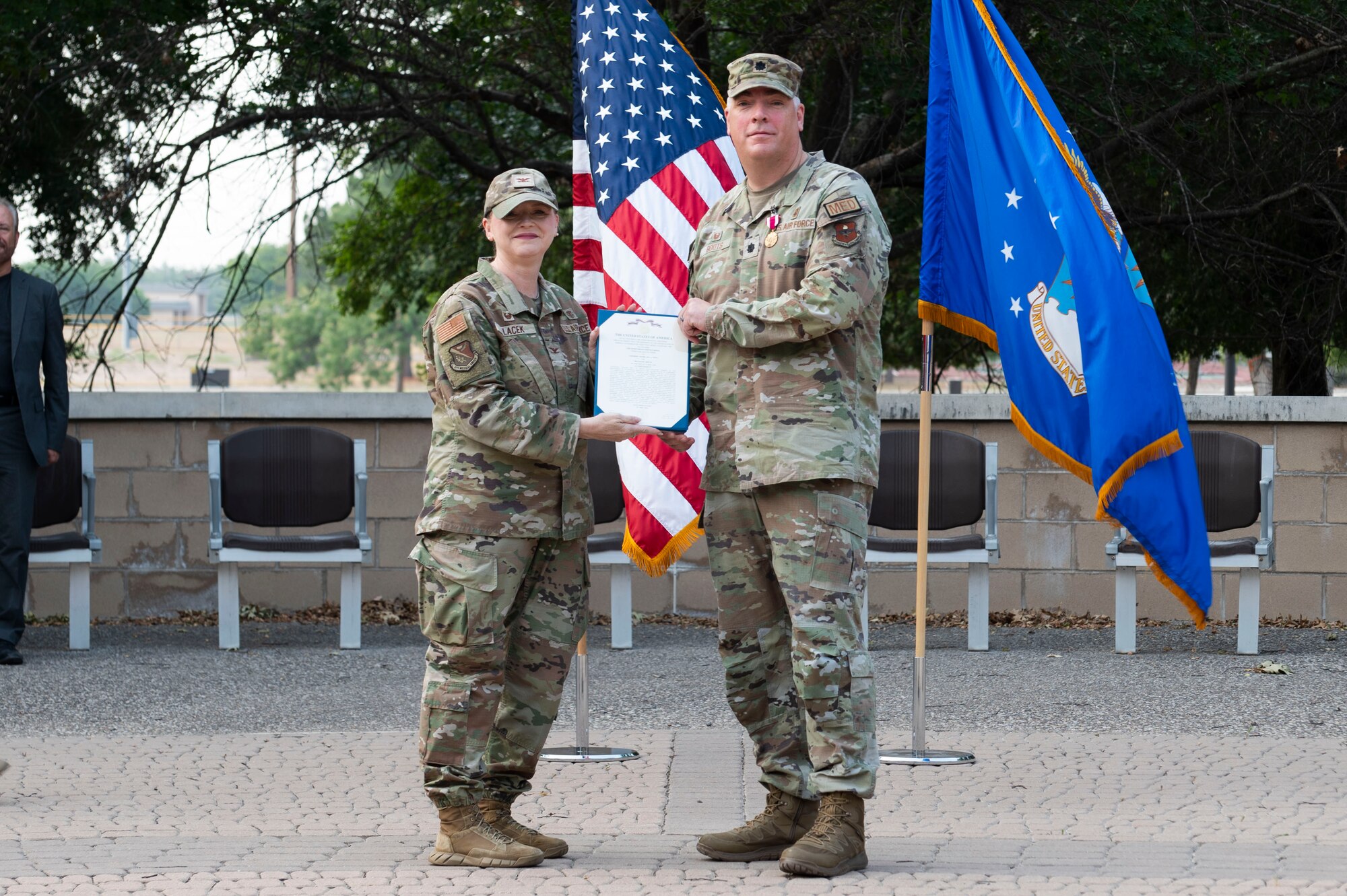 U.S. Air Force Col. Angela Lacek, 47th Medical Group commander, presents a Meritorious Service Medal to Lt. Col. Neil Boots, former 47th Healthcare Operations Squadron (HCOS) commander, during the 47th HCOS change of command ceremony at Laughlin Air Force Base, Texas, June 7, 2024. The Meritorious Service Medal was established as the counterpart of the Bronze Star Medal for the recognition of meritorious noncombatant service. (U.S. Air Force photo by Senior Airman Kailee Reynolds)