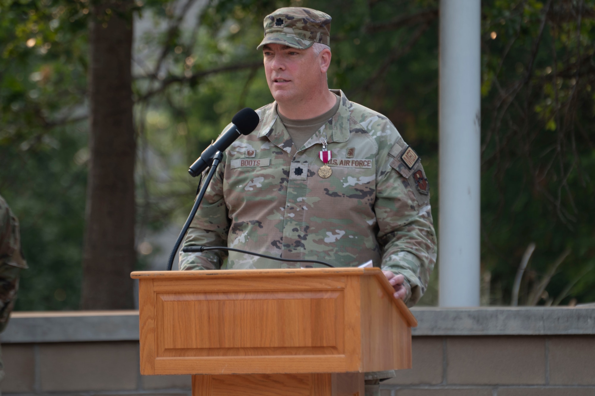 U.S. Air Force Lt. Col. Neil Boots, former 47th Healthcare Operations Squadron (HCOS) commander, gives a speech during the 47th HCOS change of command ceremony at Laughlin Air Force Base, Texas, June 7, 2024. As commander, Boots led 47th HCOS Airmen in providing healthcare services and support in Family Health, Pediatrics, Women’s Health, Laboratory, Radiology, Pharmacy, Immunizations, TRICARE and Patient Administration Services, Resource Management, Information Systems and Logistics. (U.S. Air Force photo by Senior Airman Kailee Reynolds)