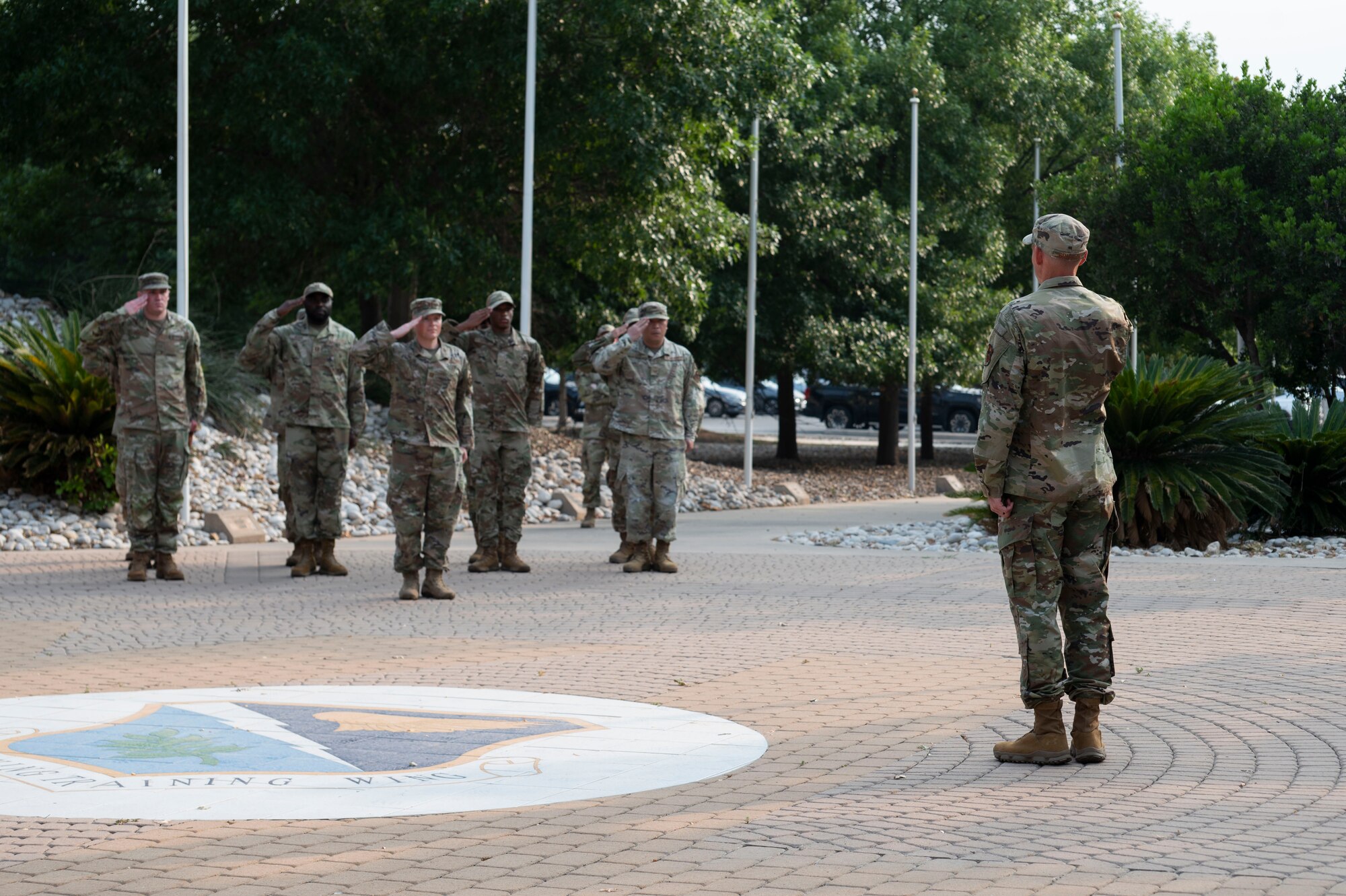 U.S. Air Force Lt. Col. Daniel Griffith (right), former 47th Healthcare Operations Squadron (HCOS) commander, presents representatives of his squadron the first salute after accepting command during the 47th HCOS change of command ceremony at Laughlin Air Force Base, Texas, June 7, 2024. As the new commander, Griffith will lead 47th HCOS Airmen in providing healthcare services and support in Family Health, Pediatrics, Women’s Health, Laboratory, Radiology, Pharmacy, Immunizations, TRICARE and Patient Administration Services, Resource Management, Information Systems and Logistics. (U.S. Air Force photo by Senior Airman Kailee Reynolds)