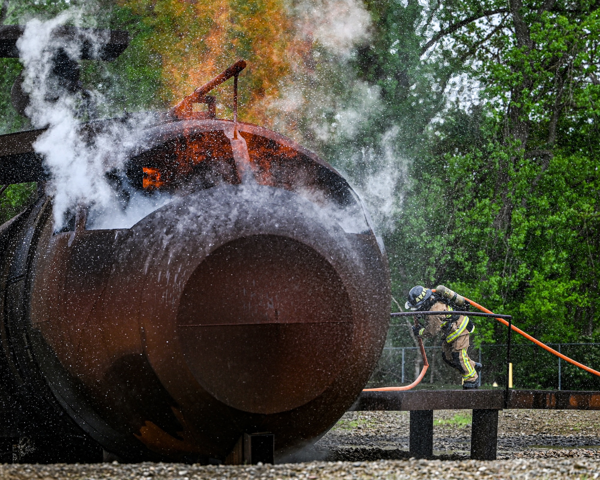 Airmen with the 445th Civil Engineer Squadron put out an aircraft structural fire during a live-fire training exercise at Wright-Patterson Air Force Base, Ohio, May 3, 2024. The annual training exposes firefighters to heat and smoke, and low-to-zero visibility they might respond to in real-world situations.