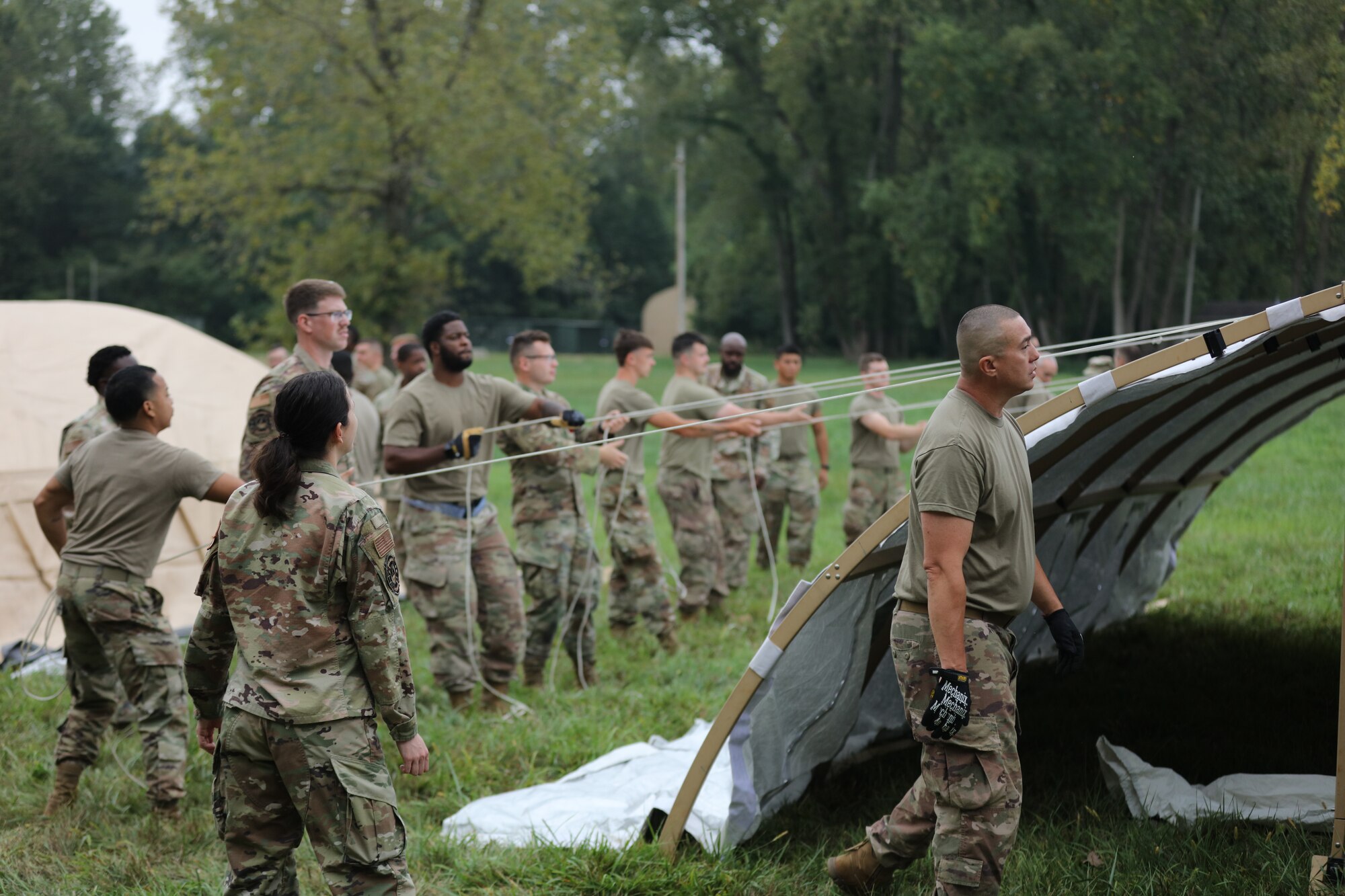 Members of the 445th Civil Engineer Squadron erect an 
Alaskan tent during a bivouac training exercise at the 
Warfighter Training Center, Sept. 7, 2023. Alaska military 
tents are lightweight, easy to setup and long-lasting. They can be scaled to provide complete base camp systems.