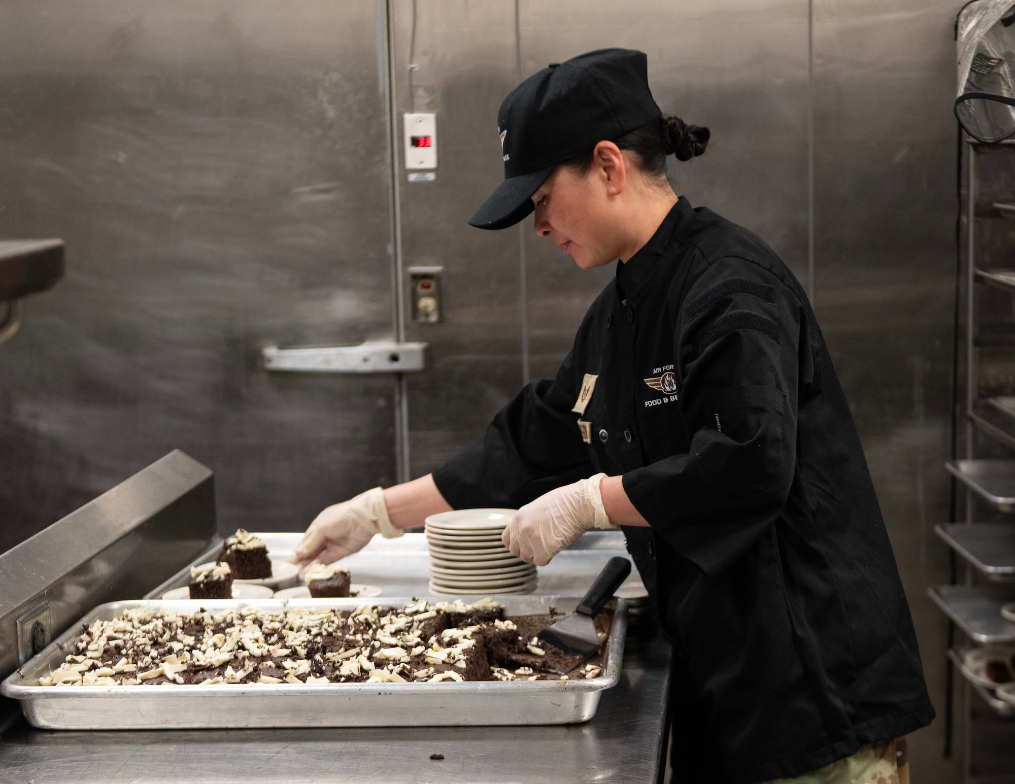 U.S. Air Force Tech. Sgt. Dieu-Huyen Johnson, 133rd Force Support Squadron, Sustainment Services Flight, plates cake in St. Paul, Minn., May 5, 2024.