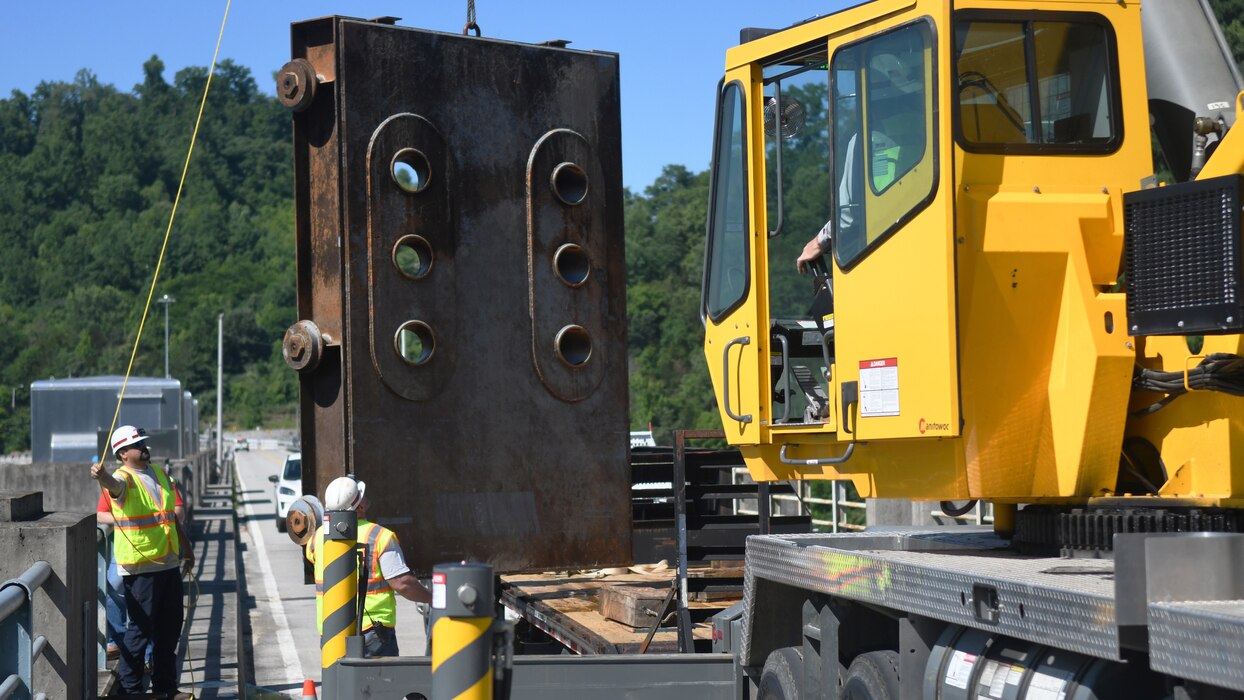 U.S. Army Corps of Engineers mechanics ensure the Center Hill Dam orifice gate is aligned correctly before it gets lowered into position after being removed last fall for inspection, at Center Hill Dam in Lancaster, Tennessee, June 10, 2024. The reinstallation of the gate establishes a new summer/fall minimum flow regime aimed at enhancing the habitat of the renowned cold-water trout fishery situated below the dam on Caney Fork River. (USACE Photo by Mike Davis)