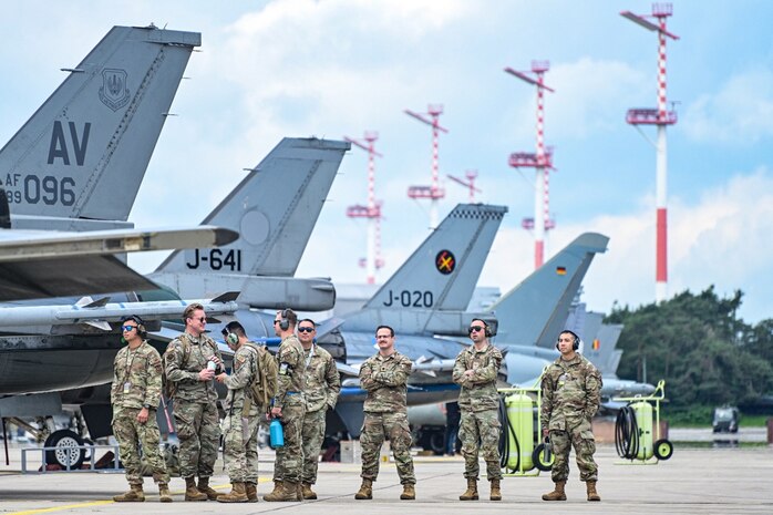 U.S. Air Force Airmen stand by during Ramstein 1-v-1, a basic fighter maneuvers exercise, June 6, 2024, on Ramstein Air Base, Germany. Maintainers of different NATO countries were given the opportunity during the exercise to cross services and learn more about each other’s airframes, guaranteeing a seamless working relationship in a multi-nation environment. (U.S. Air Force photo by Senior Airman Christian Conrad)