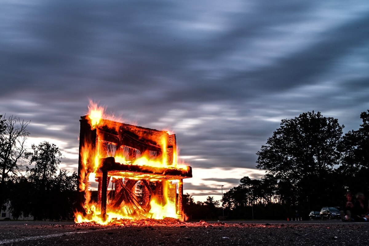 A U.S. Air Force Airman signals an F-16 Fighting Falcon to stop June 6, 2024, as part of a basic fighter maneuvers exercise held on Ramstein Air Base, Germany. The F-16 was an integral part of a simulated aerial combat exercise at the base which boasted a total of 37 aircraft, comprising both fourth and fifth-generation fighter jets. (U.S. Air Force photo by Senior Airman Christian Conrad)