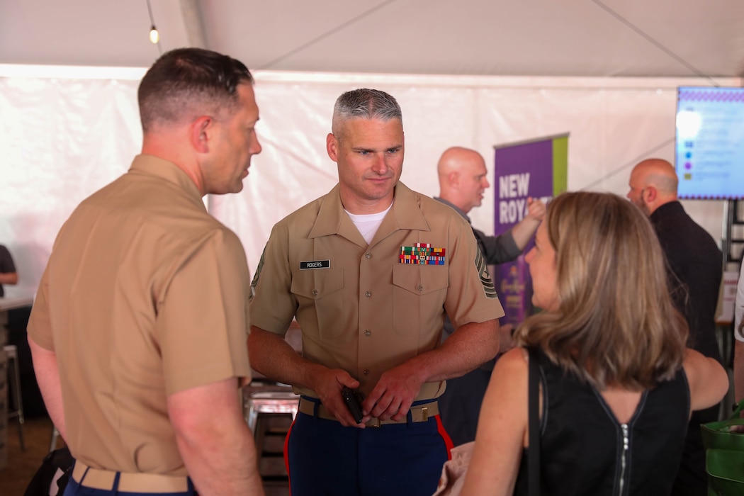 U.S. Marine Corps Lt. Col. Matthew Krempel, commanding officer of Recruiting Station Portland and Sgt. Maj. Beau Rogers speak with Brittany Stanley during a Sip to Shore Reception for Portland Fleet Week June 6, 2024. Portland Fleet Week is a time-honored celebration of the sea services and provides an opportunity for the citizens of Oregon to meet Sailors, Marines and Coast Guardsmen, as well as witness firsthand the latest capabilities of today’s maritime services. (U.S. Navy photo by Mass Communication Specialist 3rd Class Justin Ontiveros)