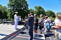 Damage Controlman 3rd Class Matthew Nacional, assigned to the Independence-variant littoral combat ship USS Montgomery (LCS 8), speaks to a tour group during Portland Fleet Week in Portland, Oregon June 6, 2024. Portland Fleet Week is a time-honored celebration of the sea services and provides an opportunity for the citizens of Oregon to meet Sailors, Marines and Coast Guardsmen, as well as witness firsthand the latest capabilities of today’s maritime services. (U.S. Navy photo by Mass Communication Specialist 1st Class Heather C. Wamsley)