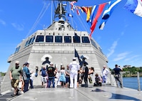 Damage Controlman 3rd Class Matthew Nacional, assigned to the Independence-variant littoral combat ship USS Montgomery (LCS 8), speaks to a tour group during Portland Fleet Week in Portland, Oregon June 6, 2024. Portland Fleet Week is a time-honored celebration of the sea services and provides an opportunity for the citizens of Oregon to meet Sailors, Marines and Coast Guardsmen, as well as witness firsthand the latest capabilities of today’s maritime services. (U.S. Navy photo by Mass Communication Specialist 1st Class Heather C. Wamsley)