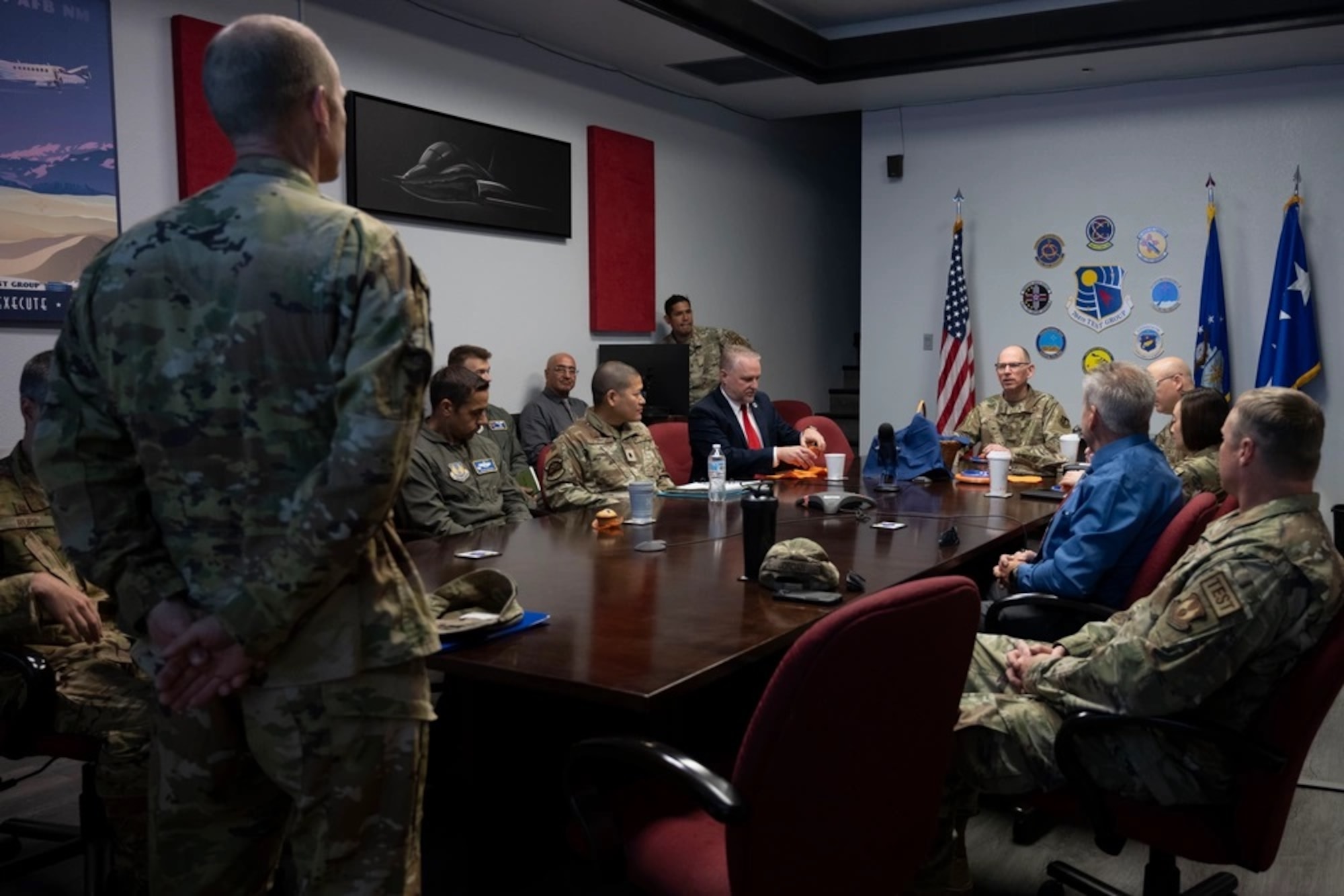 U.S. Air Force Gen. Duke Z. Richardson, Air Force Materiel Command commander, center, is briefed by U.S. Air Force Col. Karl Seekamp, Arnold Engineering Development Complex 704th Test Group commander, left, at Holloman Air Force Base, New Mexico, May 14, 2024. The AFMC command team toured the 704th Test Group facilities to gain a better understanding of their capabilities. (U.S. Air Force photo by Senior Airman Corinna Sanabia)