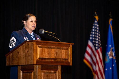 Chief Master Sgt. Fontaine gives a speech from behind a podium