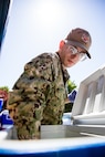 Engineman 3rd Class Jeremy Knight assigned to the Independence-variant littoral combat ship USS Montgomery (LCS 8) assists in organizing food and supplies to be distributed to the community as a part of the annual Rose Festival during Portland Fleet Week in Portland, Oregon, June 7, 2024. Portland Fleet Week is a time-honored celebration of the sea services and provides an opportunity for the citizens of Oregon to meet Sailors, Marines and Coast Guardsmen, as well as witness firsthand the latest capabilities of today’s maritime services. (U.S. Navy photo by Mass Communication Specialist 2nd Class Jordan Jennings)