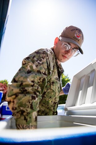 Engineman 3rd Class Jeremy Knight assigned to the Independence-variant littoral combat ship USS Montgomery (LCS 8) assists in organizing food and supplies to be distributed to the community as a part of the annual Rose Festival during Portland Fleet Week in Portland, Oregon, June 7, 2024. Portland Fleet Week is a time-honored celebration of the sea services and provides an opportunity for the citizens of Oregon to meet Sailors, Marines and Coast Guardsmen, as well as witness firsthand the latest capabilities of today’s maritime services. (U.S. Navy photo by Mass Communication Specialist 2nd Class Jordan Jennings)