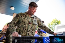 Electronics Technician 1st Class Kevin Gran assigned to the Independence-variant littoral combat ship USS Montgomery (LCS 8) assists in organizing food and supplies to be distributed to the community as a part of the annual Rose Festival during Portland Fleet Week in Portland, Oregon, June 7, 2024. Portland Fleet Week is a time-honored celebration of the sea services and provides an opportunity for the citizens of Oregon to meet Sailors, Marines and Coast Guardsmen, as well as witness firsthand the latest capabilities of today’s maritime services. (U.S. Navy photo by Mass Communication Specialist 2nd Class Jordan Jennings)