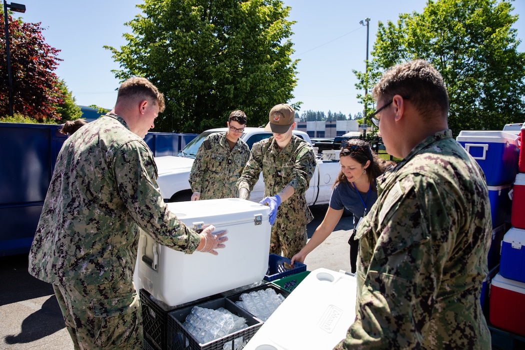 Molly Evjen, Director of Volunteers & Community Resources with Share, directs Sailors assigned to the Independence-variant littoral combat ship USS Montgomery (LCS 8) in organizing food and supplies to be distributed to the community as a part of the annual Rose Festival during Portland Fleet Week in Portland, Oregon, June 7, 2024. Portland Fleet Week is a time-honored celebration of the sea services and provides an opportunity for the citizens of Oregon to meet Sailors, Marines and Coast Guardsmen, as well as witness firsthand the latest capabilities of today’s maritime services. (U.S. Navy photo by Mass Communication Specialist 2nd Class Jordan Jennings)